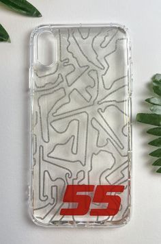 an iphone case with the number 555 on it next to some plants and leaves