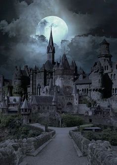 an old castle with a full moon in the background