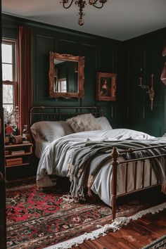 a bedroom with dark green walls and wooden floors, an antique iron bed frame is surrounded by rugs