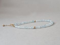 Such a beautiful bracelet with light blue genuine aquamarine rondelles Please measure tightly your wrist's circumference, using a ribbon or something similar, and then measuring the ribbon with a ruler. When ordering, please select the actual wrist size, not the size of the bracelet. I will make the bracelet fit your wrist, by adding approx 0.6 inch to the circumference. The bracelet was set up using genuine aquamarine faceted rondelles and gold filled findings and it is adjustable. Available also with sterling silver findings. The aquamarine is the stone of sailors, believing it would be protection for them on water. Folklore says the aquamarine will protect against gossip. It is also said the aquamarine will pick up spirits. It is an excellent stone to use for meditating, as it brings a Aquamarine Bracelet, Aquamarine Jewelry, March Birthstone, Jewelry Business, March Birth Stone, Gemstone Healing, Bracelet Gift, Beautiful Bracelet, Arm Band