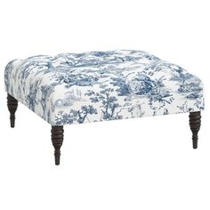 a blue and white footstool with wooden legs on an isolated white backdrop background