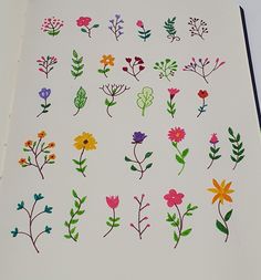 an open book with flowers drawn on it