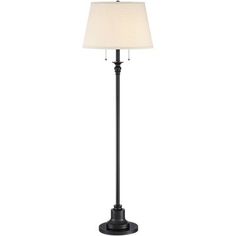 a black floor lamp with a white shade