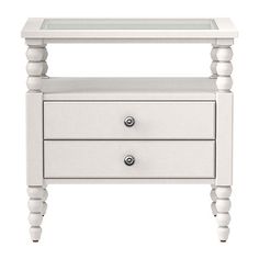 a white table with two drawers and one drawer on the bottom, in front of a white background