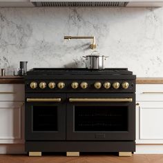 a black stove top oven sitting inside of a kitchen