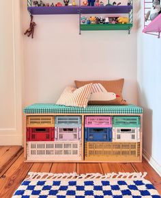 colorful shelves with toys and stuffed animals on them in a child's playroom