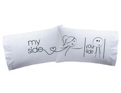 two pillows with drawings on them that say, my side is you side and your side is not