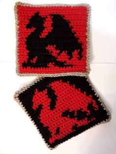 two crocheted coasters sitting next to each other