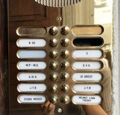 a close up of an old style phone with buttons and numbers on the front panel