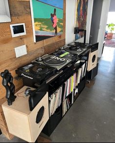 there is a record player and dj equipment in this room