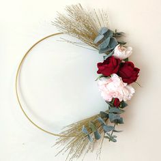 a wreath made out of flowers and leaves