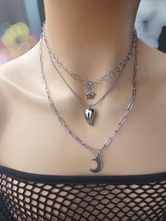 This handmade minimalist Y2K style pagan moon celestial aesthetic chain layered necklace set is 100% Stainless Steel and waterproof, sweatproof, hypoallergenic and will never tarnish. The necklace features three strands, one with a star charm, one with a crescent moon charm, and one with a water drop or teardrop charm. It is an adjustable length from approximately 16" to 18" with a built-in extender.  This necklace set is an excellent handmade gift for someone special. It is a perfect choice for Ua Oc, Pagan Moon, Celestial Aesthetic, Chain Layered Necklace, Y2k Jewelry, Layered Necklaces Silver, Pagan Jewelry, Layered Necklace Set, Moon Jewelry