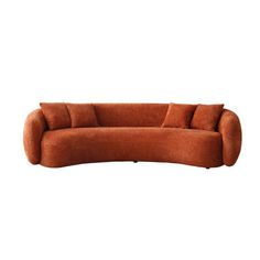 an orange couch sitting on top of a white floor