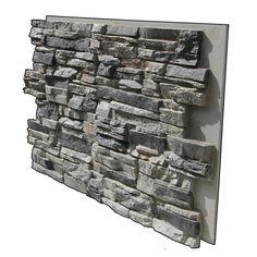 a stone wall mounted to the side of a building