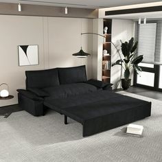 a living room with a black couch and white rug