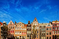 many different colored houses in the city with blue sky background stock photos and royalty illustrations