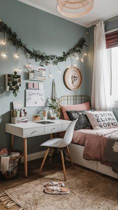 a bedroom decorated for christmas with lights and garland on the wall above the bed, along with other decorations