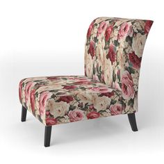 an upholstered chair with floral fabric and wooden legs, on a white background