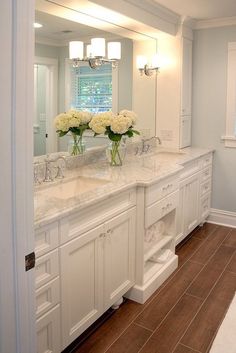 a white bathroom with two sinks and large mirrors on the wall above it is an instagram page for pinterest