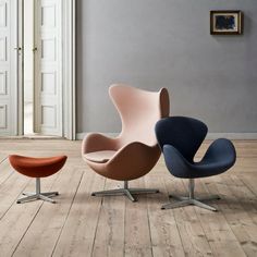 an egg chair and ottoman in a living room