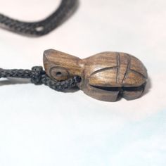 Peru Hand-Carved Natural Wooden Turtle Tortoise Pendant Necklace A Steadfast Turtle Is Hand-Carved From Natural Guacayan Wood, Centering Simple Black Cord That With No Closure. Cord Measures 12" Long #Turtle #Tortoise #Wood #Handcarved #Animals #Handmade Location Wood Or Naturefloweranimals Wood Necklace Pendant, Wooden Turtle, Dove Necklace, Chunky Bead Necklaces, Animal Necklace, Tooth Necklace, Tigers Eye Necklace, Long Pearl Necklaces, Carving Art