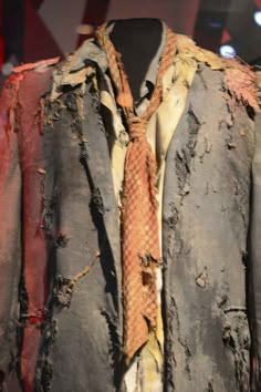 an old tie is on display in a shop window