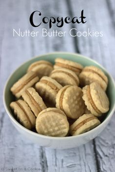 a bowl filled with cookies sitting on top of a wooden table