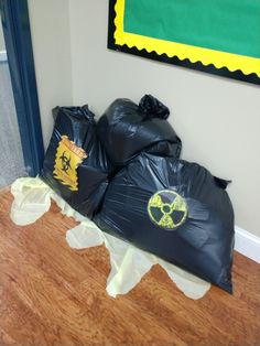 some garbage bags are sitting on the floor