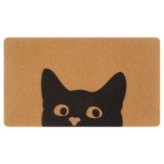 a door mat with a black cat's face on it