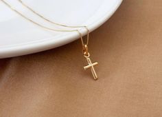 Solid Gold Cross Necklaces Made in Italy Guaranteed SOLID 10K GOLD, Stamped 10K Dainty 10K SOLID Gold Box Chain: 0.5 mm Small Cross size (not including bail): 15 mm X 13 mm x 2 mm Real Solid Gold Box Chain is secured with a Solid Gold spring clasp. Invest in SOLID GOLD: It's what's on the inside that counts. Unlike gold plated, filled or vermeil- SOLID GOLD is built to last, and won't rub off or change color over time. Perfect for those with sensitive skin as NO allergy metals are used! Tiny Cross Necklace, Letter Charm Necklace, Real Gold Chains, Custom Initial Necklace, Sterling Silver Anklet, Gold Cross Necklace, Gold Box, Jewelry Essentials, Silver Anklets