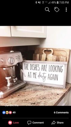 a sign that says the dishes are looking at me right again on top of a counter