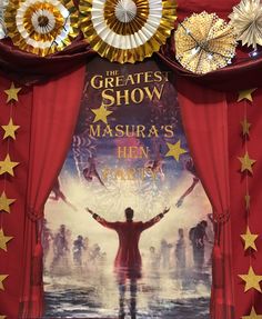 the greatest show masura's ten years poster is displayed in front of a red curtain