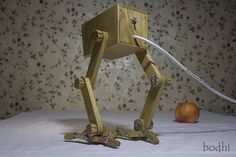 a wooden robot is hooked up to an apple