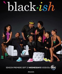 the cast of black ish sitting on a couch