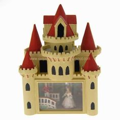 a small toy castle with a photo on it