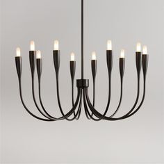 a black chandelier with eight lights hanging from it