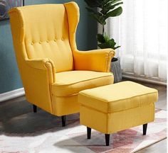 a yellow chair and ottoman in a living room