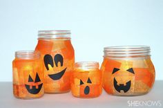 three jars with pumpkin faces painted on them