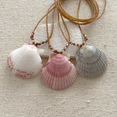 Beautiful Florida scallop seashells accented with sparkly microfaceted multicolored gemstones are handwoven onto braided waxed cord.  I found these shells on the beach on the east coast of Florida🦩. Waxed cord is strong and waterproof🌊 Perfect for women with an active lifestyle.️ Each of these are one-of-a-kind, and you will receive the necklace in the photo. These are ready to ship and will be finished to your desired length with a mother of pearl button clasp. Please choose your desired shel Beachy Necklaces, Bead Business, Seashell Necklaces, Scallop Seashell, Seashell Beach, Art Coquillage, Surf Jewelry, Jewelry Hippie, Tropical Ocean