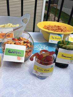 a table topped with bowls filled with food