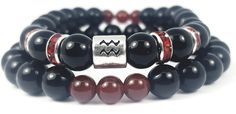 the black and red bracelets are stacked on one another with silver accents, which also feature beads