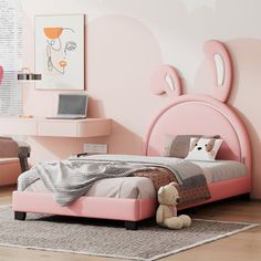 a child's bedroom with pink walls and furniture, including a bed frame in the shape of a bunny