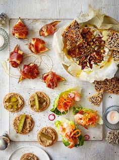 an assortment of appetizers are displayed on a table