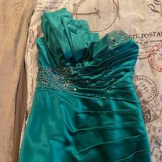 This Is A Very Pretty Jade Or Teal Green Dress One Side Shoulder Strap With Silver Beads On The Other Sided . It Come To The Knees Or A Little Shorter Also Beads On The Bottom Too Teal Green Dress, Teal Green, Dress First, Silver Beads, Colorful Dresses, Cute Outfits, Things To Come, Womens Dresses, Green