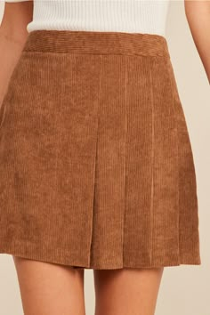 Keep it classic in the Callie Corduroy Mini Skirt! Soft and trendy corduroy shapes this high-waisted skirt with a flattering A-line silhouette and front pleats. Pair with a long sleeve top and boots for a fall-approved look! Mini Skirt Color: Camel Fit: True to size High-waisted Front pleats Hidden zipper closure A-line Model is wearing a size Small Affordable Corduroy Mini Dress For Women, Tan Fall Skirt, Cord Mini Skirt Boots, Affordable Retro Skort For Fall, Short Skirts For Fall, Affordable Fall Top With Corduroy Collar, Cheap Chic Fall Skort, Cheap High-waist Mini Skirt For Fall, Cheap Pleated Skort For Fall