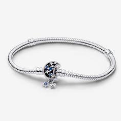 Bring a celestial touch to your style with the Pandora Moments Sparkling Moon Clasp Snake Chain Bracelet. With a clasp shaped like a crescent moon, this sterling silver snake chain bracelet has a "Dream big" engraving on the clasp's back. The intricate clasp features cut-out stars and circles set with six blue man-made crystals and five clear cubic zirconia, as well as microbeading and imprinted detailing. Two asymmetrical stars set with sparkling stones dangle from the clasp, adding a dash of movement to this essential piece. - Pandora Moments Sparkling Moon Clasp Snake Chain Bracelet - Sterling silver / Mixed stone / Blue - Sz. 7.9 in