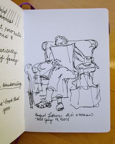 an open book with a drawing of a man sitting in a chair