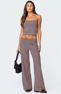 These Edkited Lilah striped fold-over wide-leg pants are the perfect choice when you want to feel comfortable while still looking put together. Rock them with their matching tube top to complete the look.PantsWide leg fitFold over waistbandStriped patternMatching setCotton, Polyester, SpandexModel wears size SModel height is 5'9Item care: Machine wash at maximum 30C, do not bleach, do not tumble dry, iron at a maximum of 110C, do not dry clean. Edikted Womens Lilah Striped Fold Over Pants size XL Chic Striped Wide Leg Pants For Loungewear, Fold Over Pants, Looking Put Together, Striped Lounge Pants, Put Together, Lounge Pants, Striped Pants, Fold Over, Tube Top