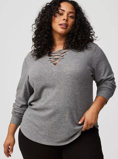 FIT Measures 31” from shoulder (size 2). MATERIALS + CARE Waffle knit fabric. 64% polyester, 33% rayon, 3% spandex. Machine wash cold. Tumble dry low. Imported. DETAILS V-shaped neckline. Long sleeves. The best plus size women's waffle lace up v-neck long sleeve top lace-up tops in heather grey made of waffle. Torrid is your destination for cozy fall and winter clothes to keep you warm and comfortable. Long Sleeve Sweatshirt, Winter Clothes, Cozy Fall, Lace Tops, Waffle Knit, Long Sleeve Sweatshirts, V Shape, Heather Grey, Knit Fabric