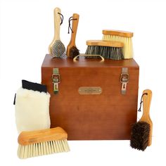 a wooden box filled with different types of cleaning supplies